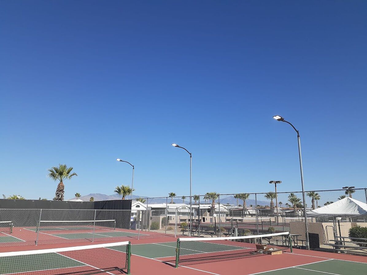 LED court lighting on existing poles above the pickleball and tennis courts at an RV resort in Tucson, Arizona