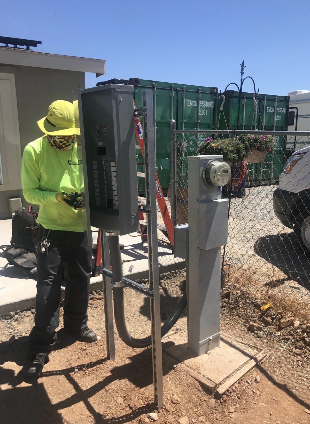 Arizona Electrical Solutions electrician working on residential service equipment in Tucson, Arizona