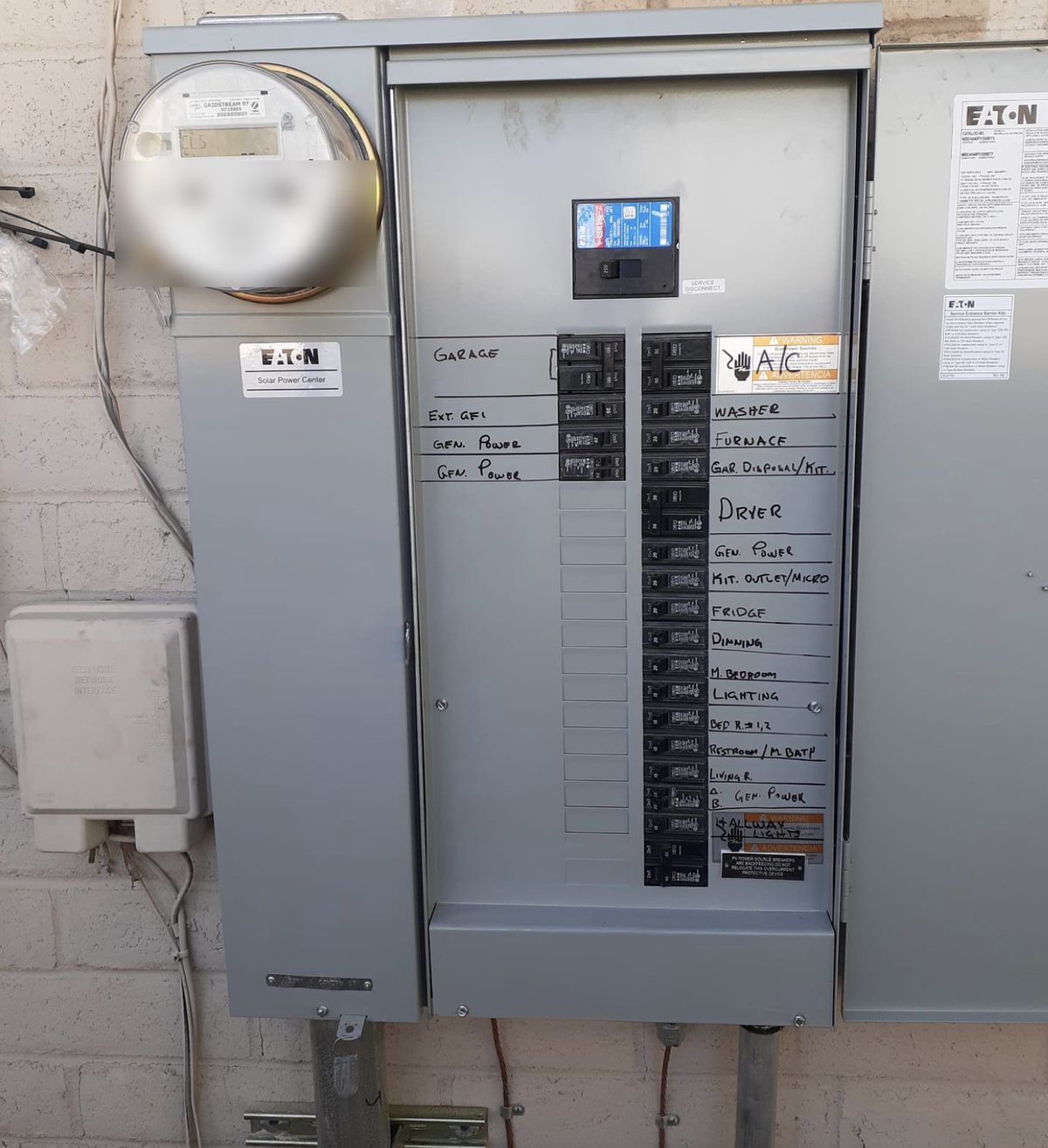 Completed residential panel upgrade with a fully labelled circuit directory and utility meter, Tucson, Arizona