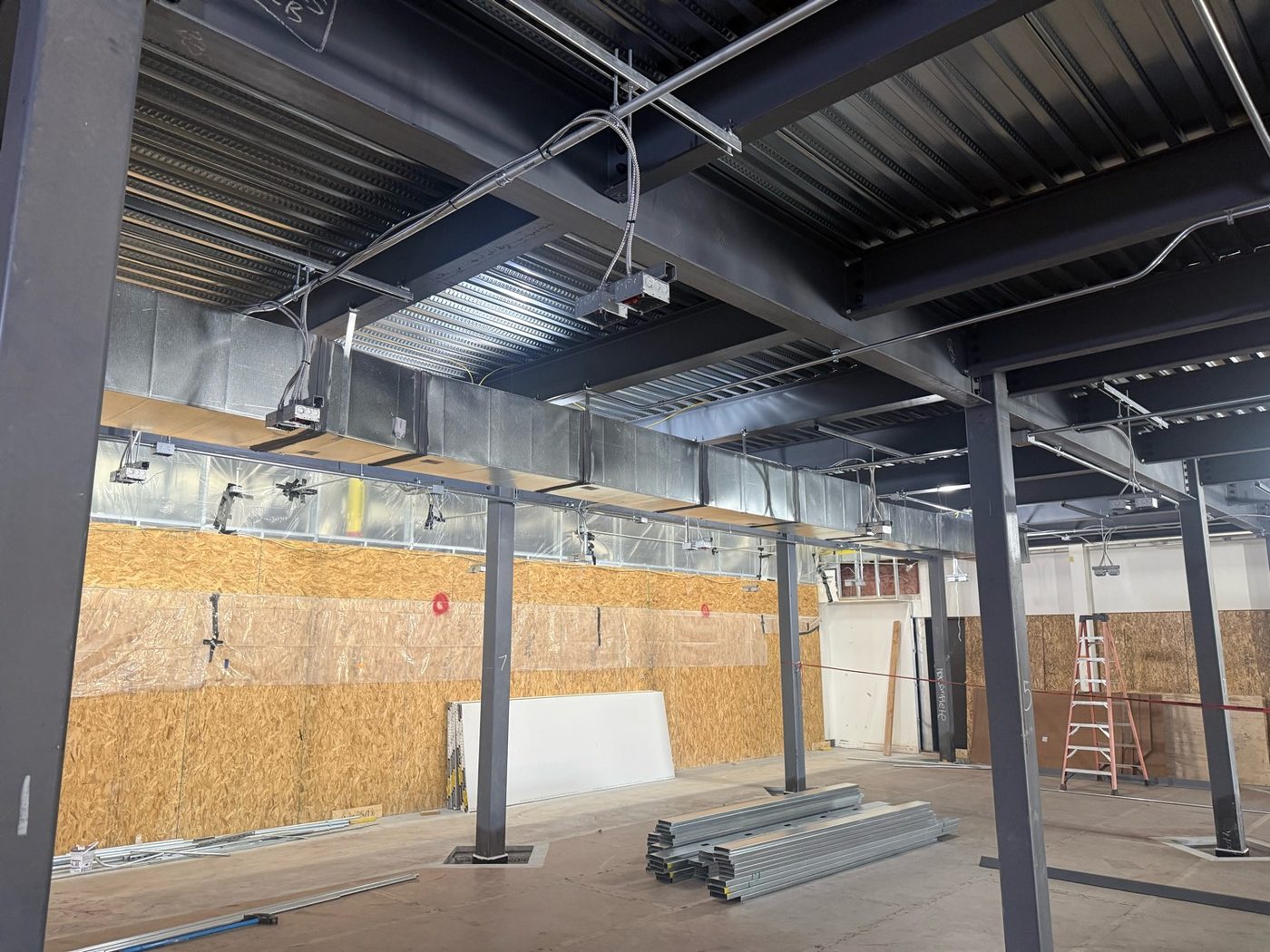 Commercial tenant buildout self-performed by Arizona Electrical Solutions — structural steel, ductwork, and MEP rough-in in Tucson, Arizona